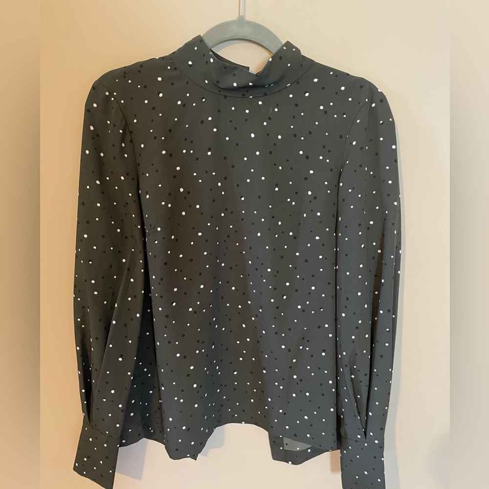 H&M green polka dotted blouse. Buttons down the back.